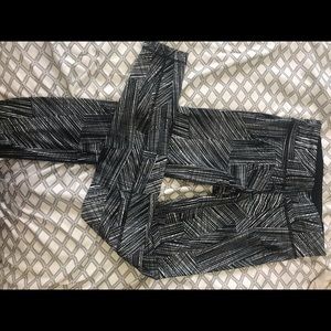 White and black patterned UnderArmour leggings